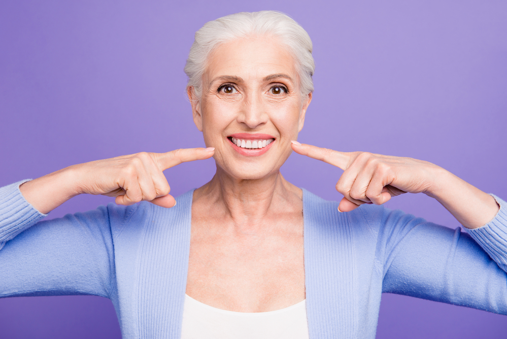 Concept of having strong healthy white perfect teeth at old age.